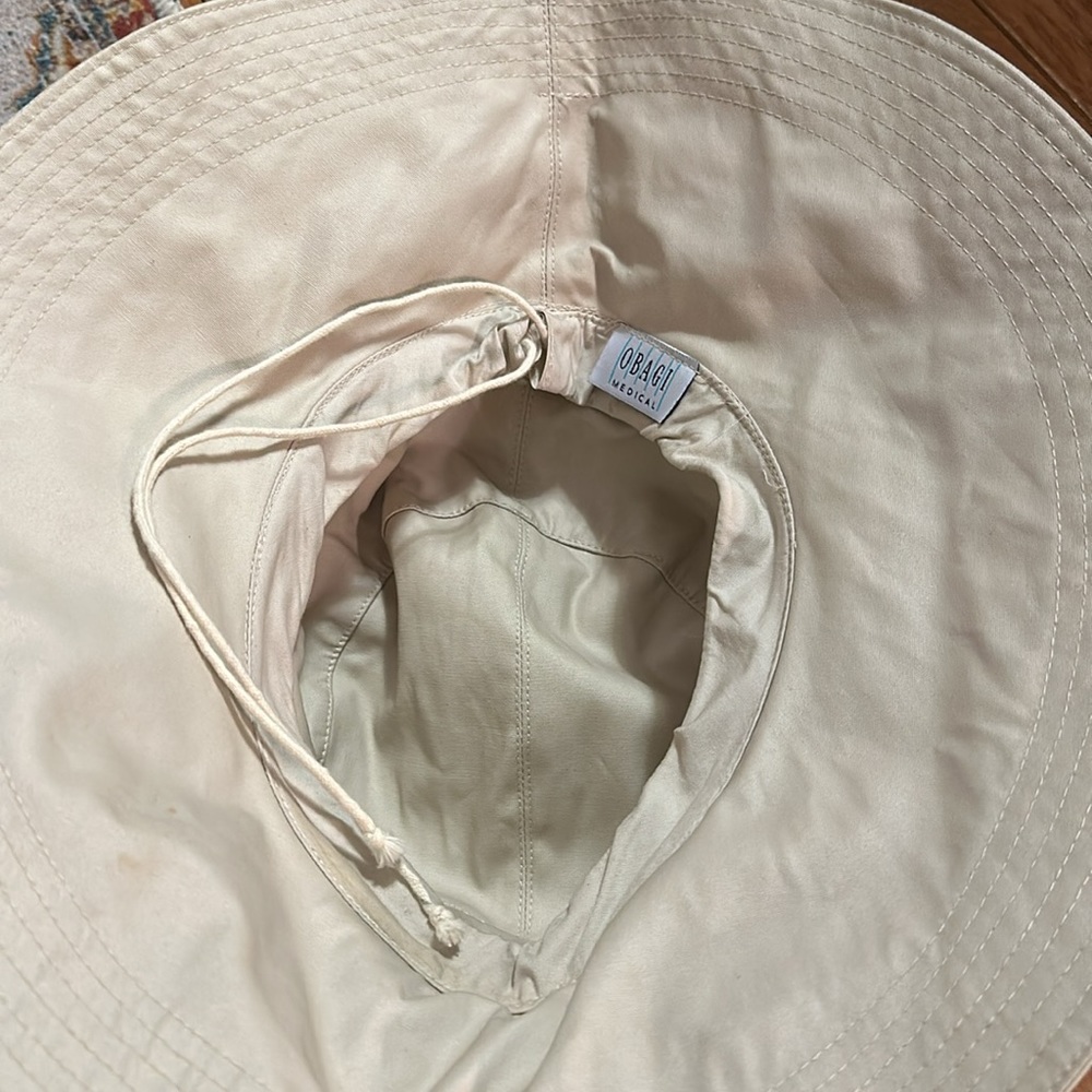 Cream colored rain bucket hat Obagi medical - Picture 6 of 8